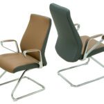 Brown PU leather visitor chair with a cushioned seat and chrome cantilever base, designed for office and reception use.