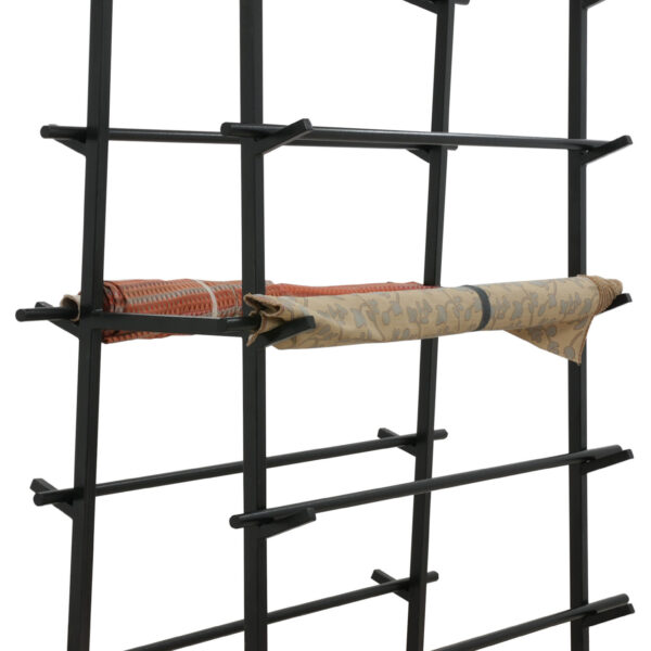 Black double sided cantilever rack designed for securely holding and displaying multiple fabric rolls in retail or warehouse settings